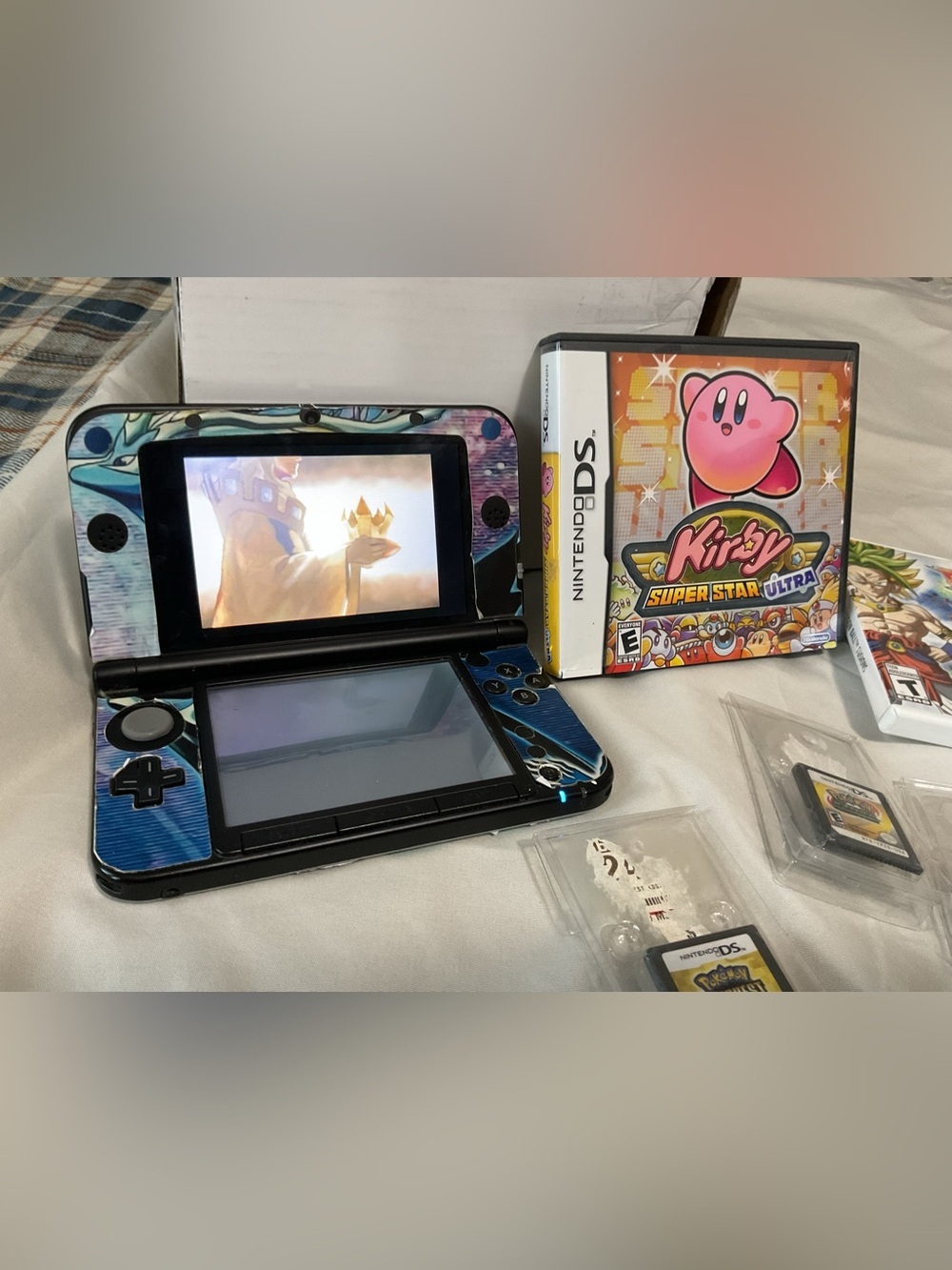 Nintendo 3DS XL Pokémon skin Handheld with 9 Game Cartridge Bundle - Picture 2 of 9